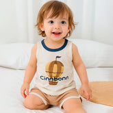 Smiling toddler wearing a sleeveless top with hot air balloon print and matching shorts